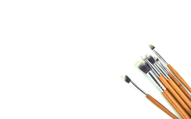 Brushes for cosmetics of different sizes on a white background. Isolate. Selective focus. - Photo, Image