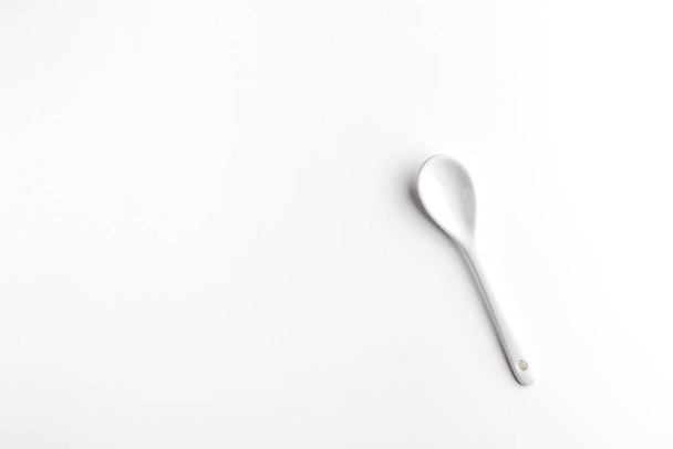 White spoon isolated on a white surface - Photo, Image