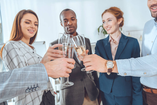 business team celebrating with beverage in glasses at office space    - Photo, Image