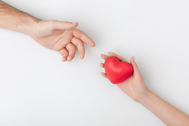 cropped view of hands with red heart isolated on white background - Photo, Image