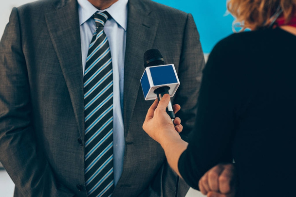 Journalist interviewing business person on public event   - Photo, Image