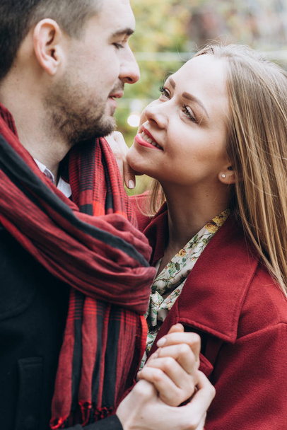beautiful couple in love posing outdoors in autumn  - Фото, изображение