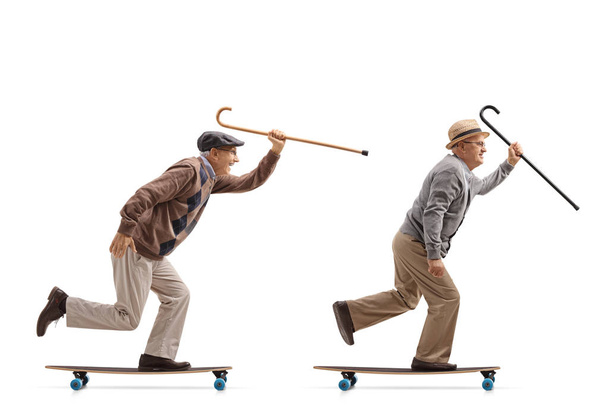 elderly men with canes riding longboards - Фото, изображение
