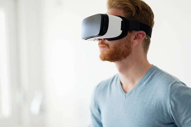 Man wearing virtual reality headset  - Fotoğraf, Görsel