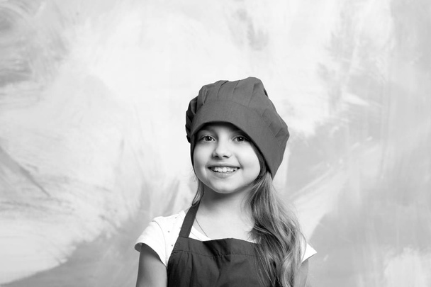 small girl chef with happy face in hat and apron - Photo, Image