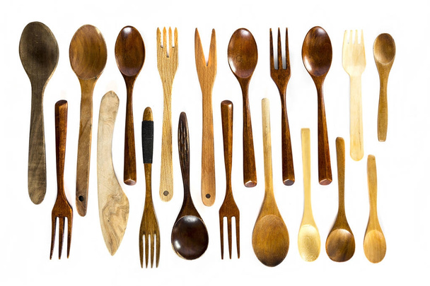 Wooden spoons and forks on white background - Foto, Imagen