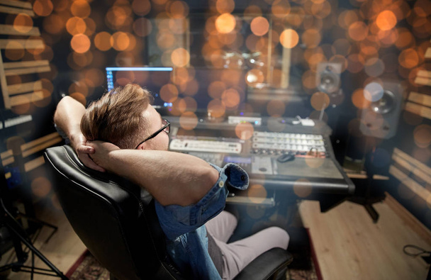man at mixing console in music recording studio - Foto, Imagem