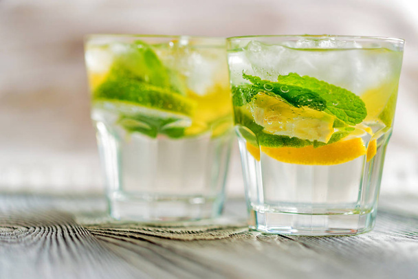 Lemonade or mojito cocktail with lemon and mint - Zdjęcie, obraz