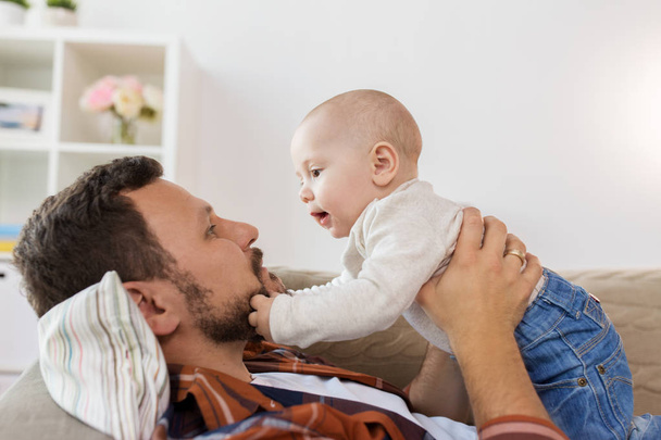 happy father with little baby boy at home - Фото, изображение