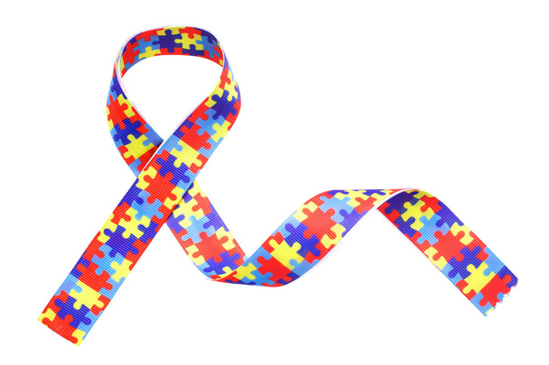 World Autism awareness and pride day with Puzzle pattern ribbon isolated on white - Фото, зображення