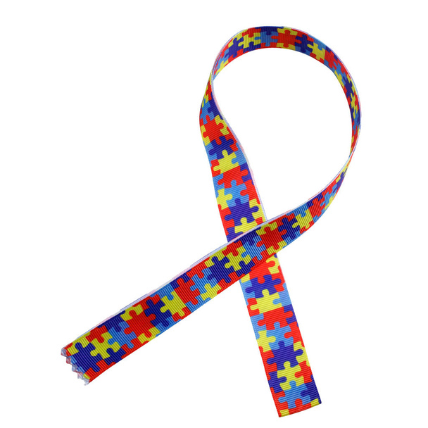 World Autism awareness and pride day with Puzzle pattern ribbon isolated on white - Foto, afbeelding