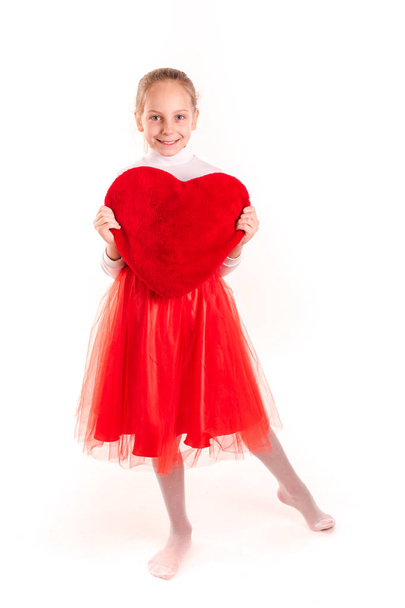 Cute little girl holding red heart isolated - Zdjęcie, obraz