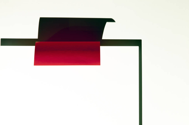 A red paper and its shadow on a wall - Photo, Image