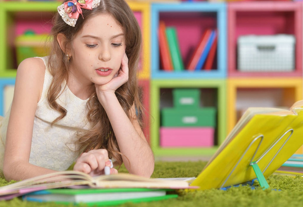 little cute girl doing homework at home - Zdjęcie, obraz