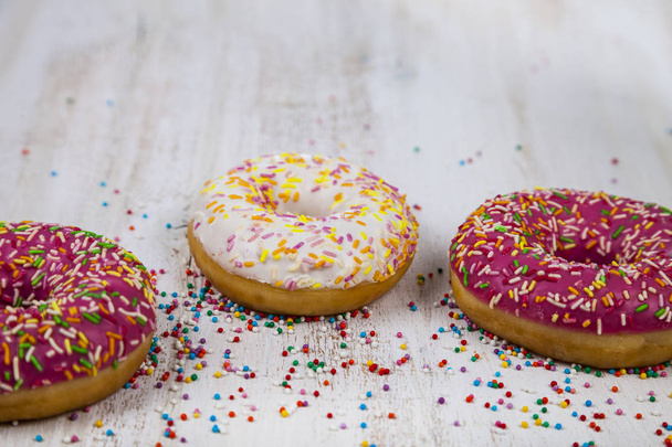 Multicolored donuts close-up - Фото, изображение