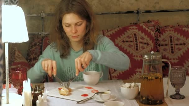 Happy woman eating sweet tasty dessert - Materiał filmowy, wideo