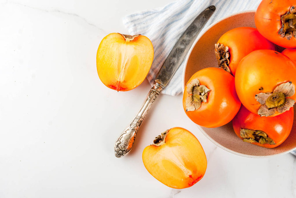 Raw ripe persimmon - 写真・画像