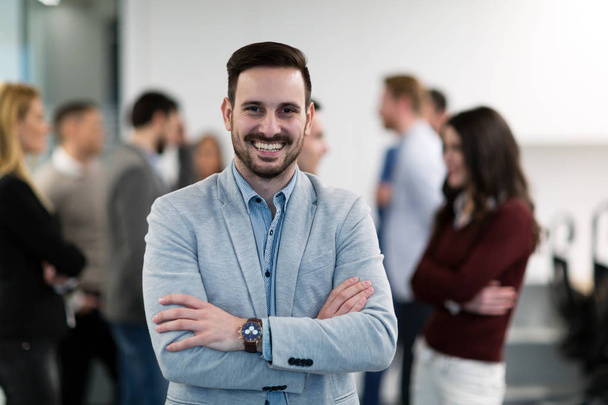 Portrait of young perspective businessman posing in office - Photo, Image