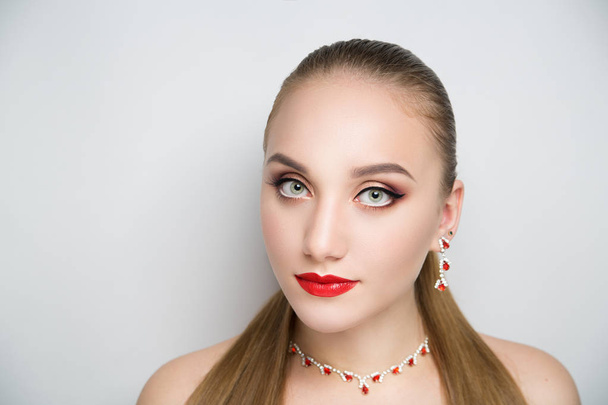 girl with red lipstick and silver jewelry - Zdjęcie, obraz