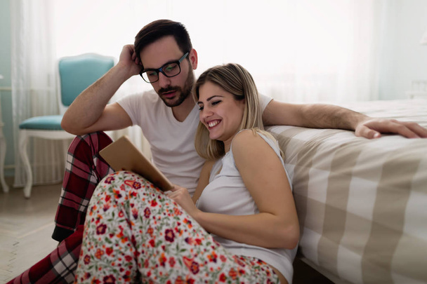 Young attractive couple using tablet  - Foto, imagen