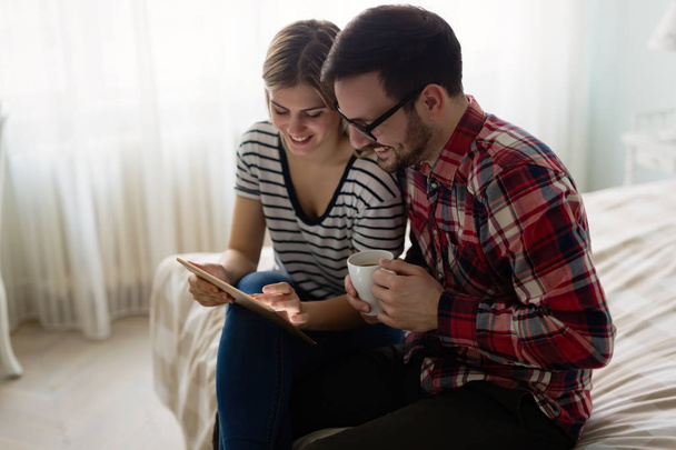 Young attractive couple using tablet - Foto, Imagen