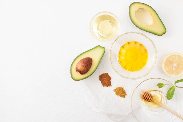 Recipes avocado with honey on white background - Valokuva, kuva