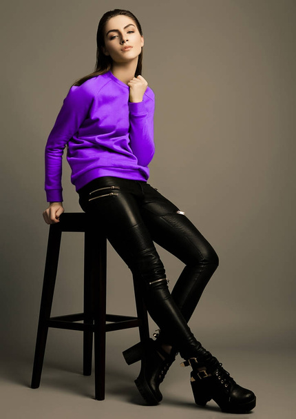 Beautiful fashion model with violet purple jumper - Photo, image