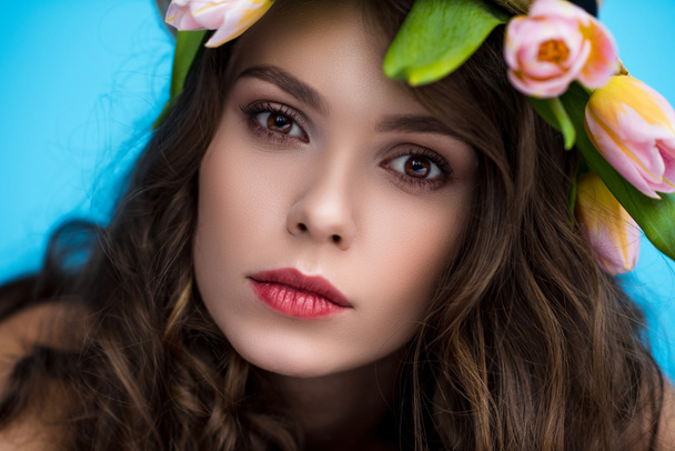 close-up portrait of sensual young woman with wreath made of tulip flowers - Photo, Image