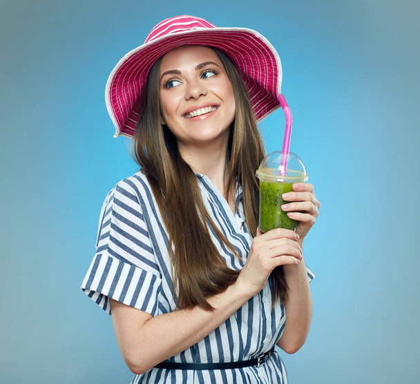 Happy woman holding glass with green juice.  - Fotoğraf, Görsel