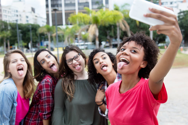Group of girlfriends taking crazy selfie - Foto, Bild