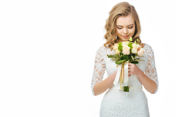 portrait of young bride with wedding bouquet in hands isolated on white - Foto, imagen