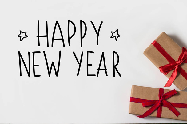 Two gifts on a white background. Added text Happy New Year - Photo, Image