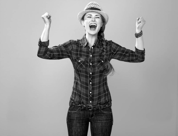 Portrait of happy young woman grower in checkered shirt  - Valokuva, kuva