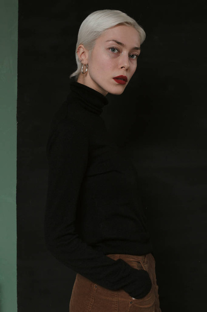 Beautiful emotional girl with white hair on a black background - Zdjęcie, obraz