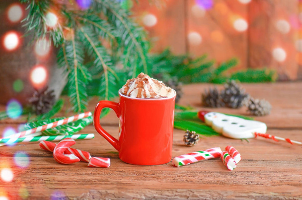 Hot chocolate with whipped cream on festive background.  Selective focus and copy space. A cup of cappuccino or hot chocolate - Photo, Image