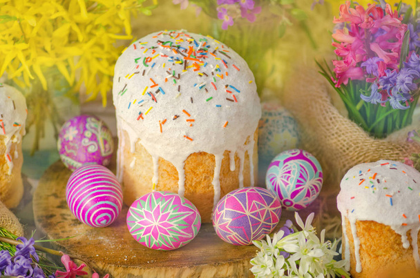 Ukrainian traditional Easter bread paska or kulich. Easter  eggs with flower blossom.  Homemade Easter bread and painted eggs  - Photo, Image