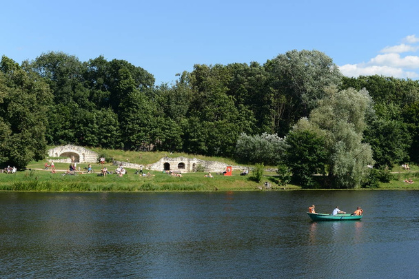 MOSCOW, RUSSIA - AUGUST 6, 2017:Upper Kuzminsky pond in the natural-historical park "Kuzminki-Lublino". View of the Grotto. - Zdjęcie, obraz