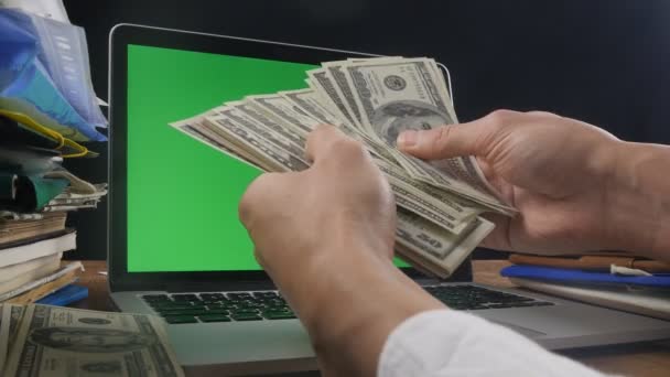 Concept of Money making, your logo on green screen of laptop. - Video, Çekim