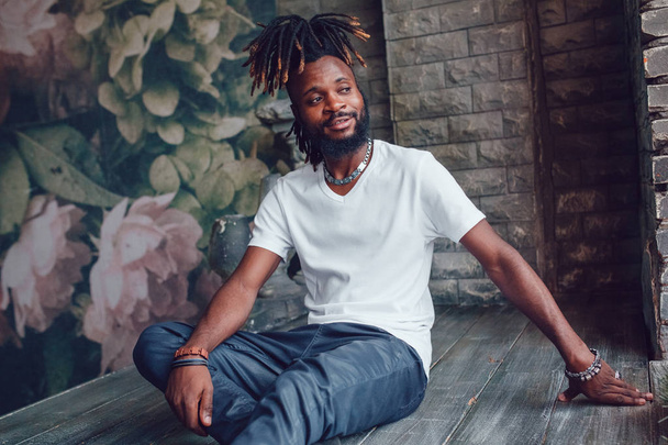 African American man with dreadlocks and a white T-shirt. Mock-up. - Fotografie, Obrázek