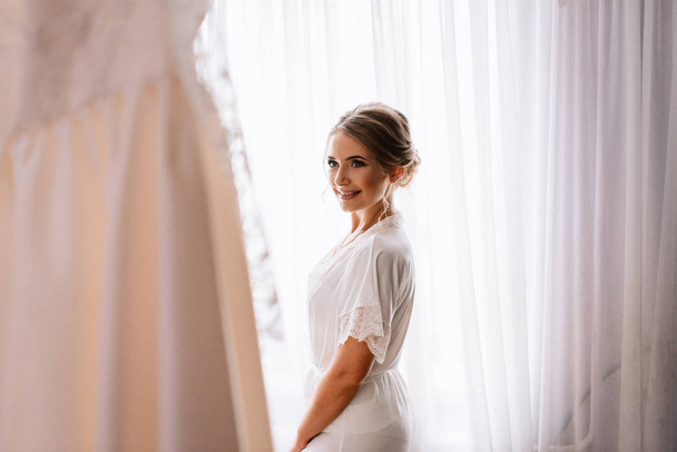Portrait of beautiful young woman getting ready for her wedding  - Фото, изображение