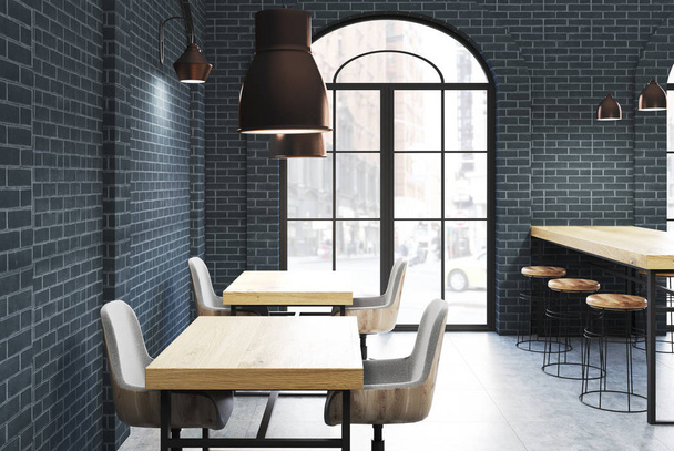 Black brick cafe, wooden tables side - Zdjęcie, obraz