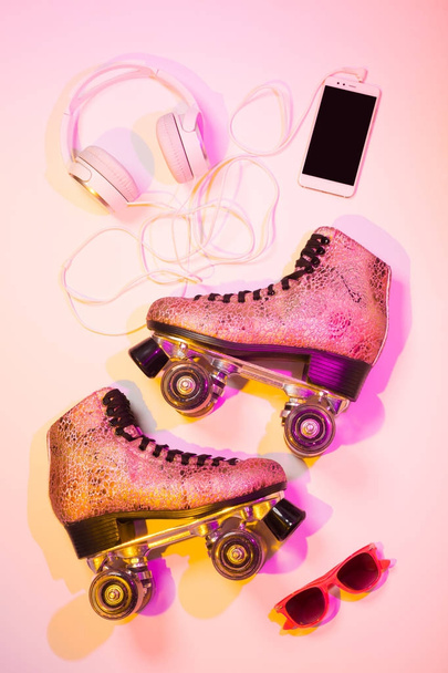 Roller skates, smartphone, headphones and sunglasses - 写真・画像