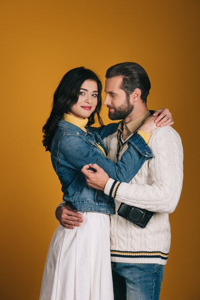 boyfriend and girlfriend hugging isolated on yellow - Fotografie, Obrázek