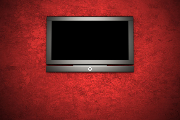 Lcd tv en la pared de estuco rojo
 - Foto, imagen
