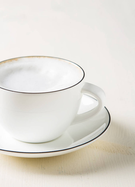 Italian homemade espresso coffee in a white mug. Light backgroun - Фото, зображення