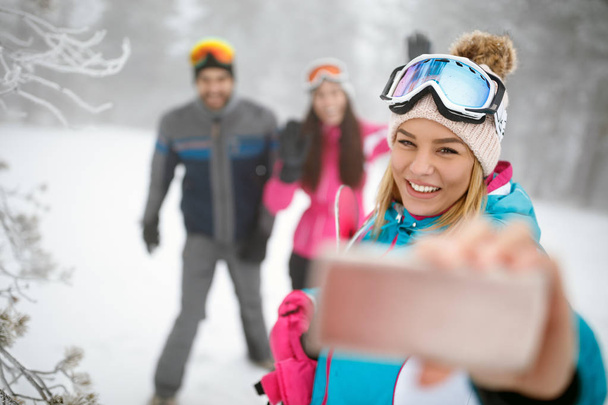 Female making selfie on skiing - Photo, image