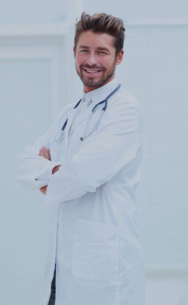 Portrait of confident male doctor with arms crossed standing - Фото, зображення