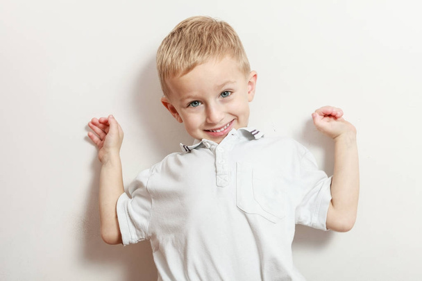 Little boy have fun with funny gestures - Фото, изображение