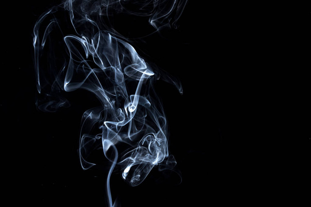 Abstract, white smoke isolated on black background. Isolate - Photo, Image