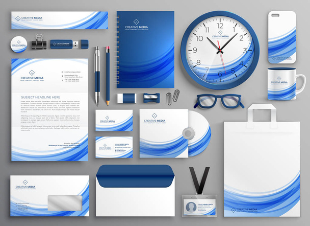 фирменные деловые канцелярские принадлежности в синей волнистой форме
 - Вектор,изображение